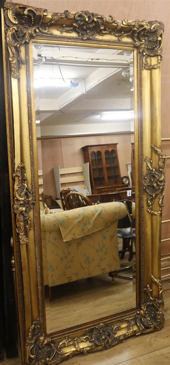 A large gilt moulded framed wall mirror, W.184cm